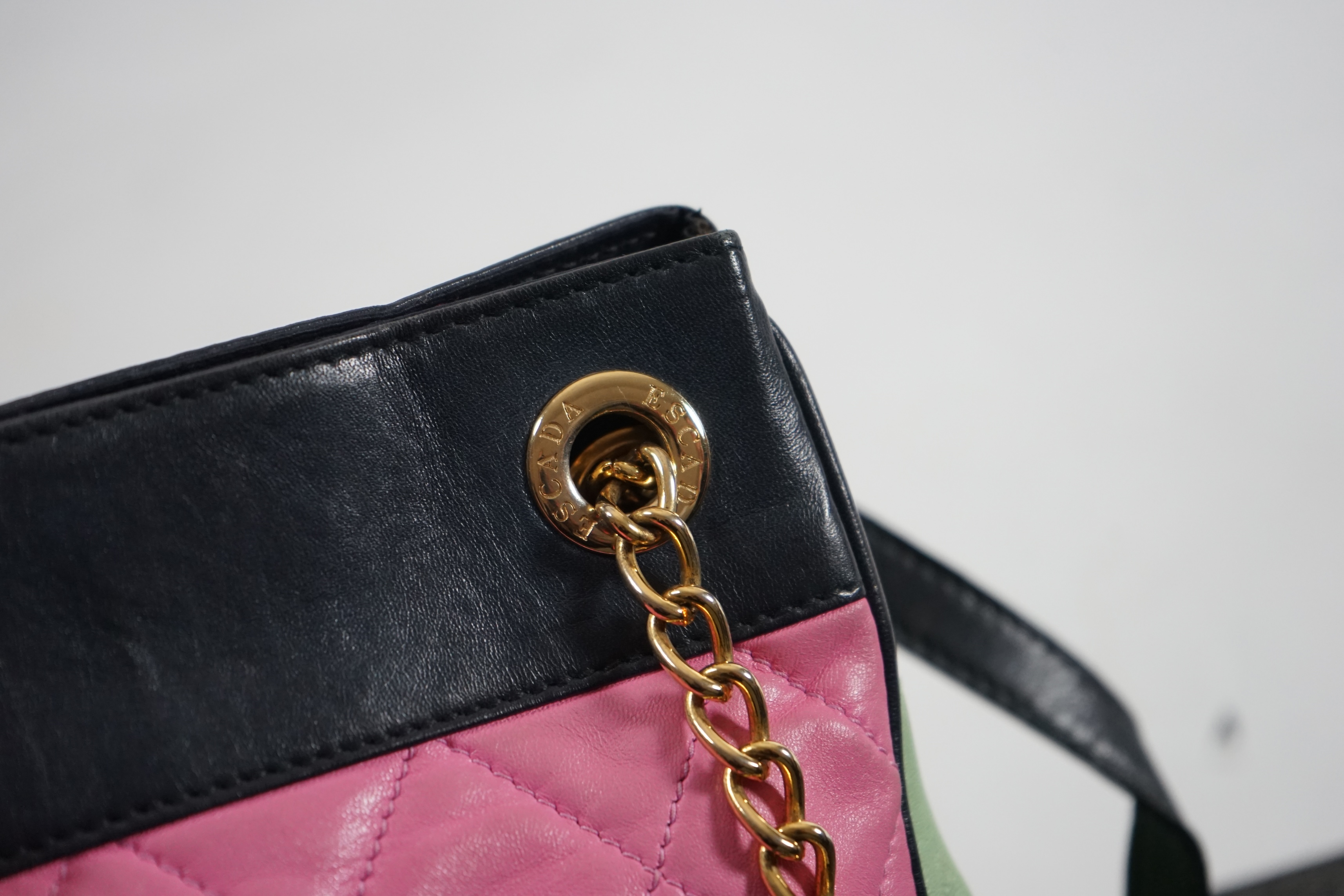 A selection of lady's handbags, including an animal print Stuart Weitzman shoulder bag with dust bag, an Escada suede royal blue and red shoulder bag, and another Escada handbag in navy blue with pink and light green qui